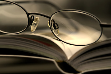 Image showing Close up on the Glasses and the Magazine