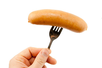 Image showing Sausage on a fork isolated on white 