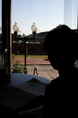 Image showing Woman Silhouetter by the Windon in St. Louis