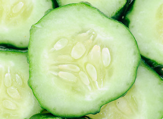 Image showing cucumber sliced as food background.