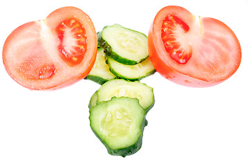 Image showing cucumber and  tomato sliced isolated on white background.