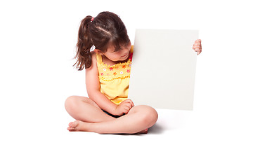 Image showing Cute girl sitting with whiteboard