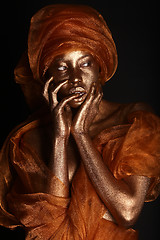 Image showing Stunning African Amercian Woman Painted With Gold 