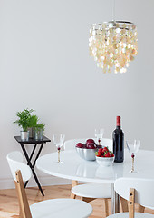Image showing Dining room decorated with beautiful chandelier