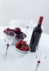 Image showing Red wine and fruits on a table