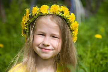 Image showing little girl in yellow dandelion wreath