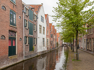 Image showing Traditional dutch buildings on canal in Alkmaar