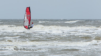 Image showing Alone surfer on board in sea 