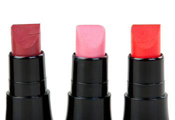 Image showing Three lipstick set in a row