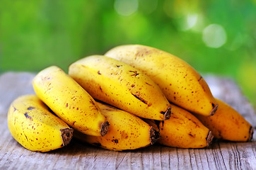 Image showing Yellow bananas on table