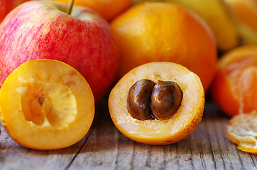 Image showing Half of ripe loquat medlar