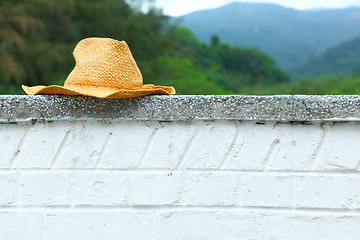 Image showing Wicker hat on the wall 