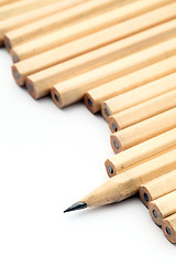 Image showing Row of unused pencil with one sharpened 