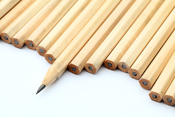 Image showing Row of unused pencil with one sharpened 