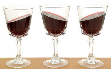 Image showing Three wineglasses and gravity