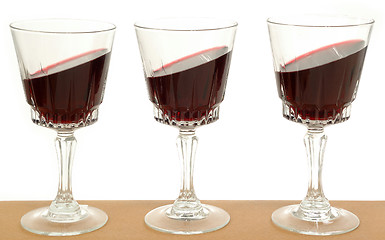 Image showing Wineglasses and gravity