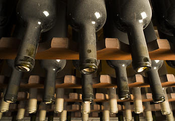 Image showing Wine bottles on shelf