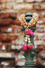 Image showing Garland of flowers hanging at a temple in Thailand