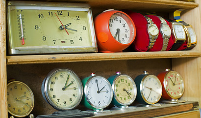 Image showing Old clocks on a shelf