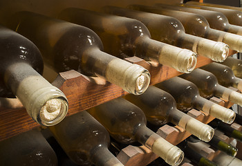 Image showing Wine bottles on shelf