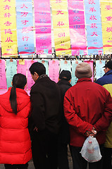 Image showing People read good luck messages in China. Chinese New Year celebr