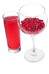 Image showing fresh grains and juice pomegranate in glass