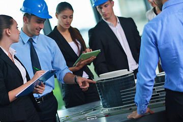 Image showing business people and engineers on meeting