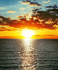 Image showing red sunset over water with waves