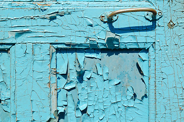 Image showing part of cracked old painted blue door