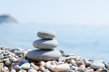 Image showing stack of zen stones near sea