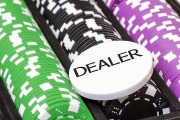 Image showing Set of poker chips and dealer button