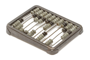 Image showing Old metallic abacus on white