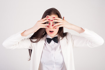 Image showing shocked young woman with closwd eyes