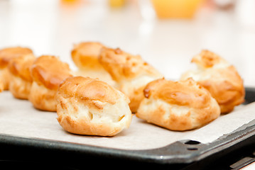 Image showing delisious profiteroles on the baking tray