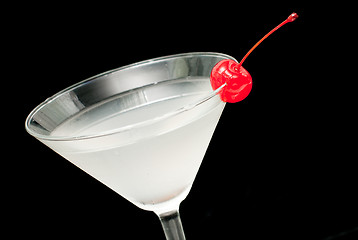 Image showing cocktail in martini glass witj red cherry closeup
