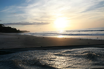 Image showing Sunrise over sea and lake