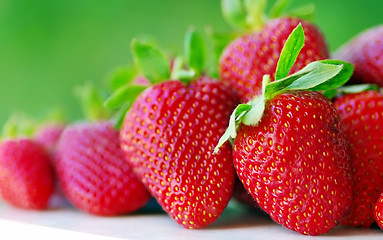 Image showing fresh strawberry on the clean green background