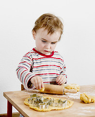 Image showing young child making cookies