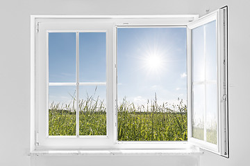 Image showing white half open window with sun