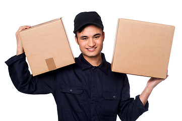 Image showing Smart courier boy delivering parcels