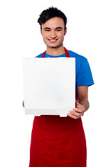 Image showing Guy delivering pizza at your door step