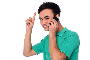 Image showing Cheerful young boy communicating