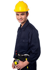 Image showing Smiling construction worker in yellow hard hat