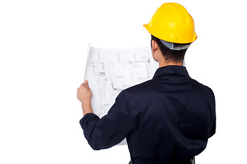 Image showing Civil engineer reviewing blueprint