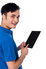 Image showing Smart guy holding touch pad