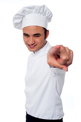 Image showing Smart young chef pointing at camera