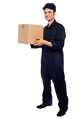 Image showing Young boy delivering parcel