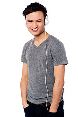 Image showing Young guy enjoying music