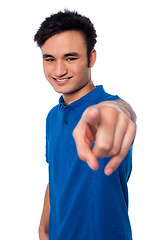 Image showing Young man pointing finger at you