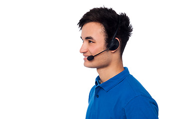 Image showing Young friendly guy wearing headset